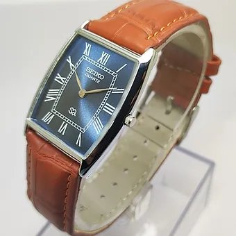 Seiko Slim Barrel Quartz Blue Face Brown Band Men's Wrist Watch C87