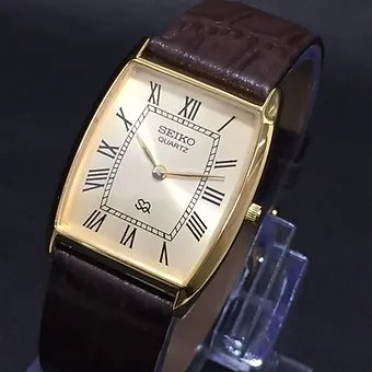 Seiko Slim Barrel Quartz Golden Face Brown Band Men's Wrist Watch C95